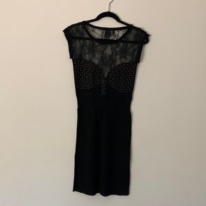 Little black dress. Lace and chest hardware details. Size S.